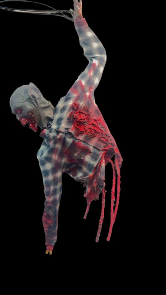 Zombie colgado con un solo brazo